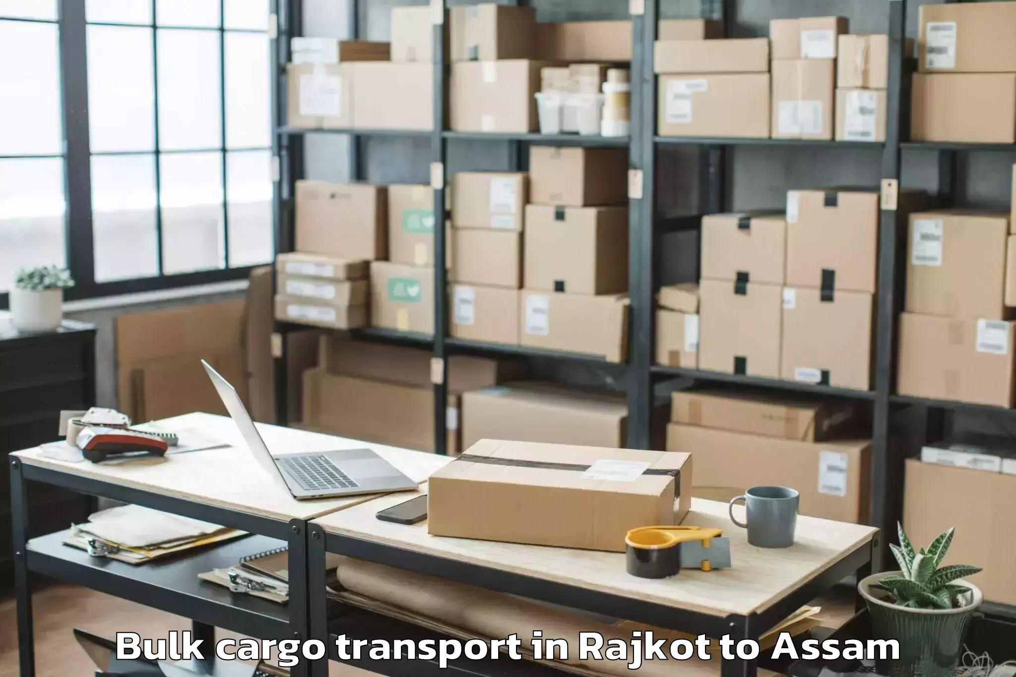 Top Rajkot to Abhilashi University Jorhat Bulk Cargo Transport Available